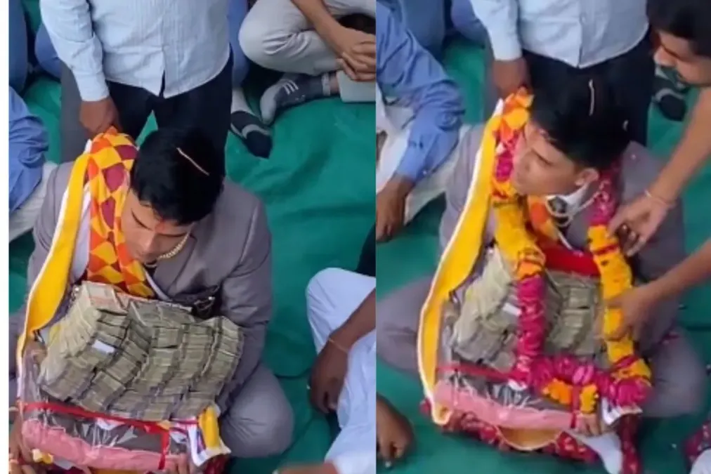 दुल्हन दूल्हे वायरल वीडियो: दूल्हे की गोद में कैश ऑफ कैश सोशल मीडिया हलचल पैदा करता है, नेटिज़ेन कहते हैं 'खरेद लीया'