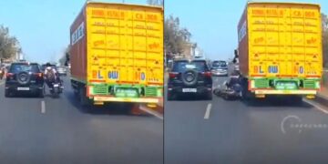 वायरल वीडियो: लापरवाह! एक बाइक पर तीन युवा ट्रक और एसयूवी के बीच से आगे निकलने की कोशिश करते हैं, पहिया के नीचे बहते हैं, जांचें कि क्या होता है