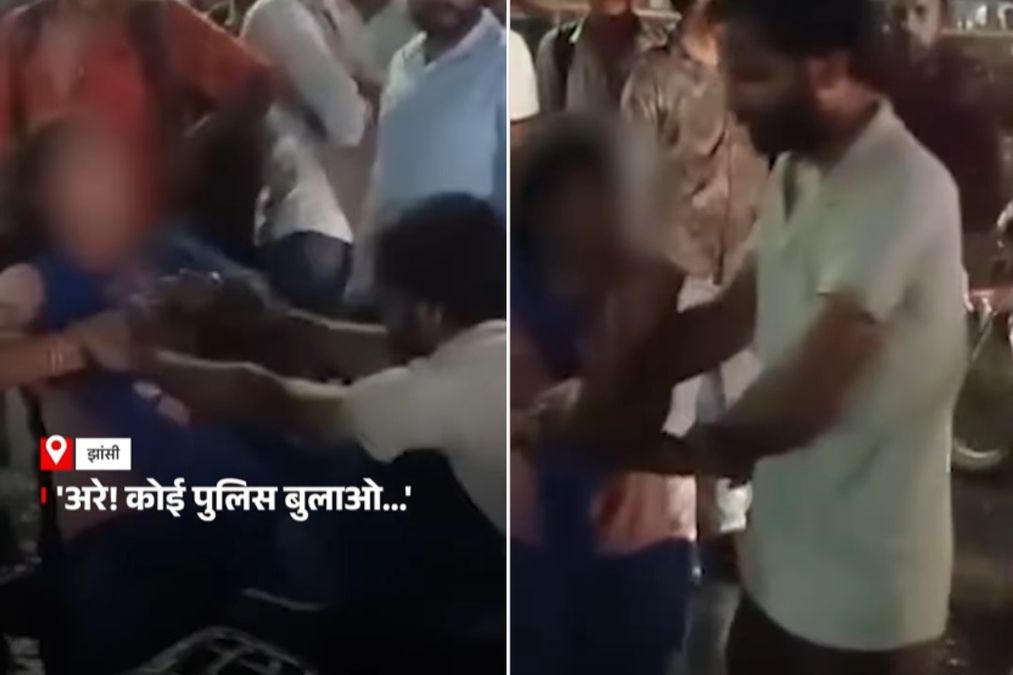 झांसी वायरल वीडियो: आदमी व्यस्त चौराहे पर एक अन्य व्यक्ति के साथ पत्नी का सामना करता है, सार्वजनिक परिवर्तन हिंसक, झटके में भीड़ बदल जाता है