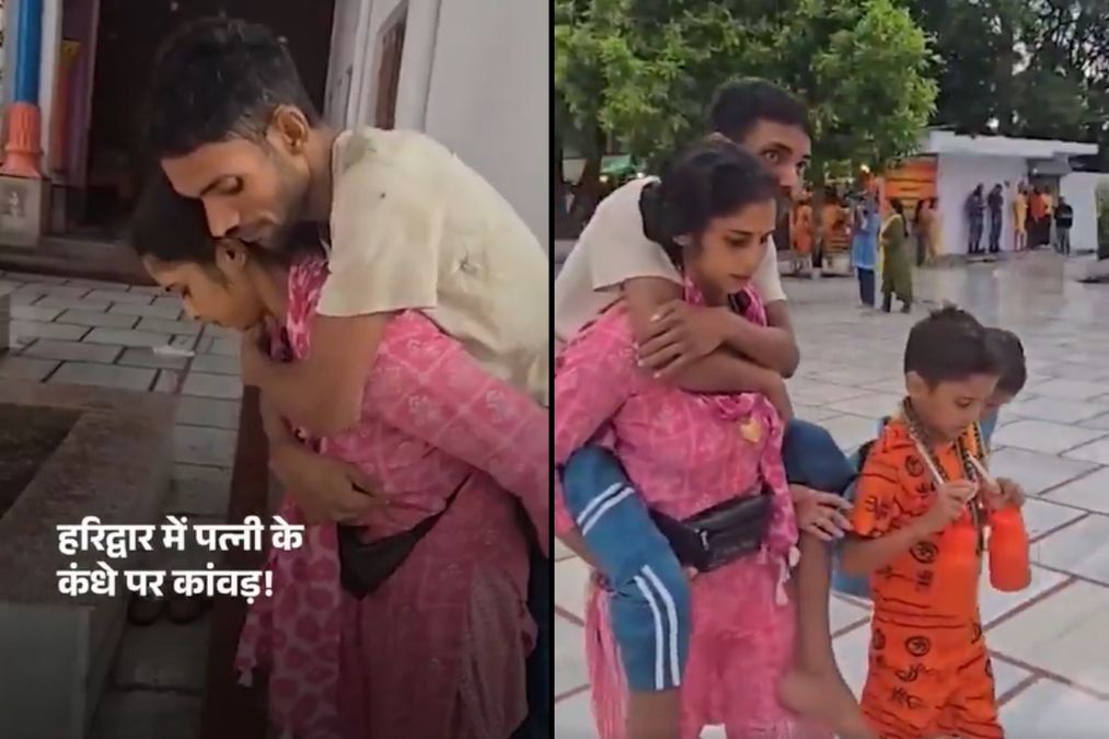 हरिद्वार वायरल वीडियो: महिला 2025 में बाबा के आशीर्वाद के लिए कंधों पर पति को वहन करती है, लोग चले गए, घड़ी